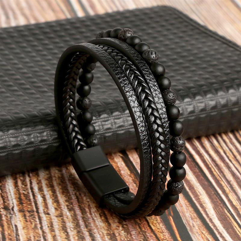 Handcrafted boho men’s tiger eye and leather bracelet, multilayer wrap design displayed on surface.
